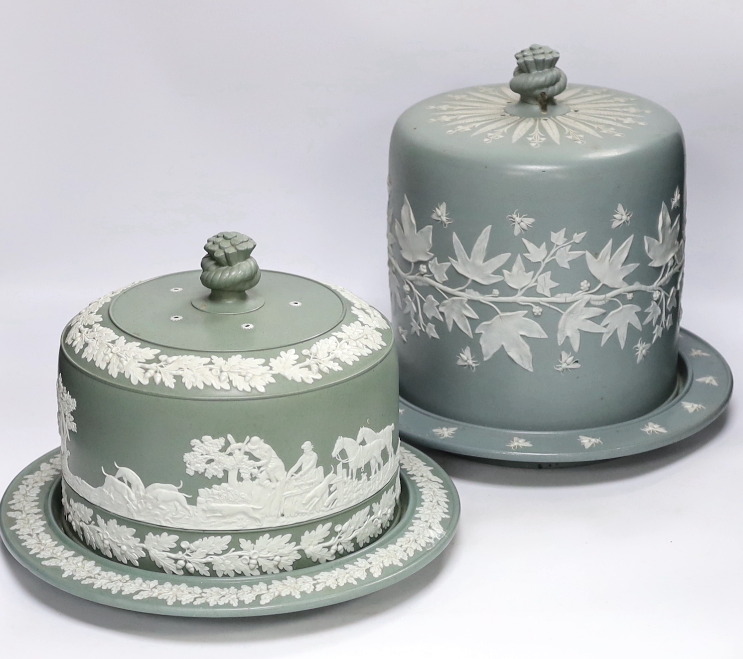 Two Victorian Dudson green glazed and white sprigged cheese dishes and covers, tallest 29cm